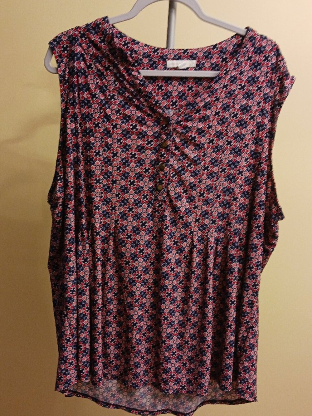 Westport sleeveless pullover top with a partial button with geometr print